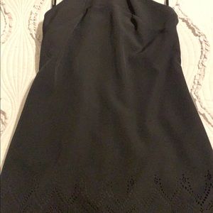 Black dress. In the back is a T shape.